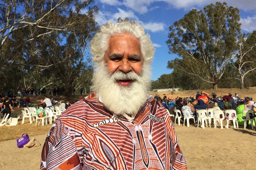 Tumut elder Uncle Pat Connolly in front of crowd at Wagga Wagga corroboree