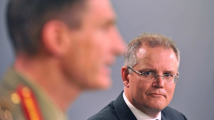 Scott Morrison listens to Angus Campbell