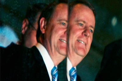 Peter Costello, then Treasurer, reflected in glass as he arrives at the Liberal Party of Australia's Federal Council in June ...