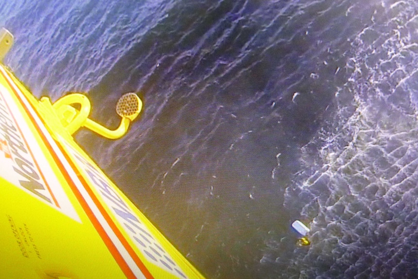 Men rescued clinging to esky after boat capsize