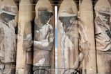 Murals of rural figures cover the side of 30-metre high silos in the rural town of Brim.