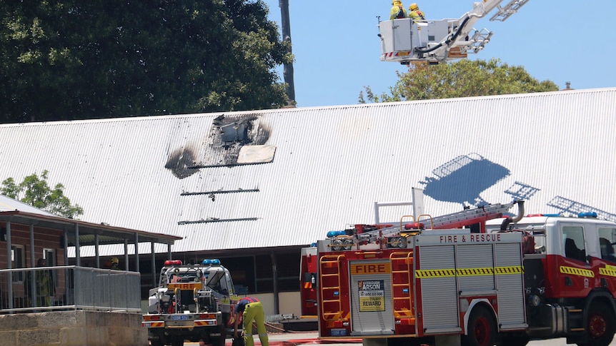 Firefighters at the scene of a roof fire at Osborne Park Primary School.