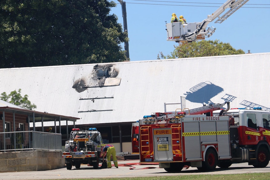 Firefighters at the scene of a roof fire at Osborne Park Primary School.