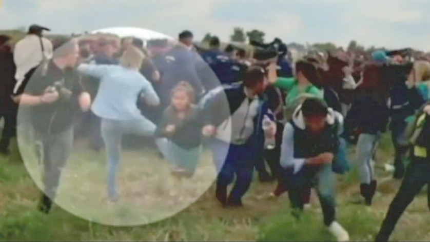 Hungarian camerawoman kicks asylum seekers