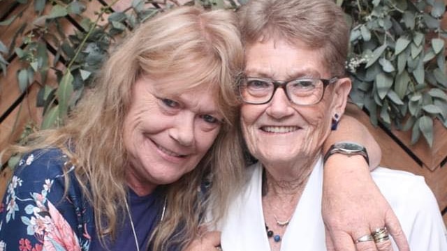 Sue Skeer hugs her mum Nan Walker as they both smile for the camera