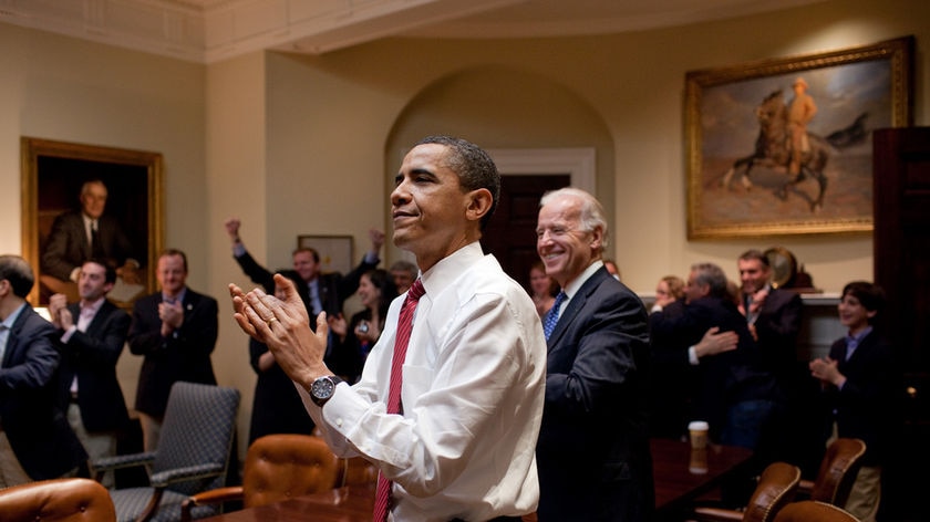US President Barack Obama and Vice President Joe Biden celebrate health reform bill