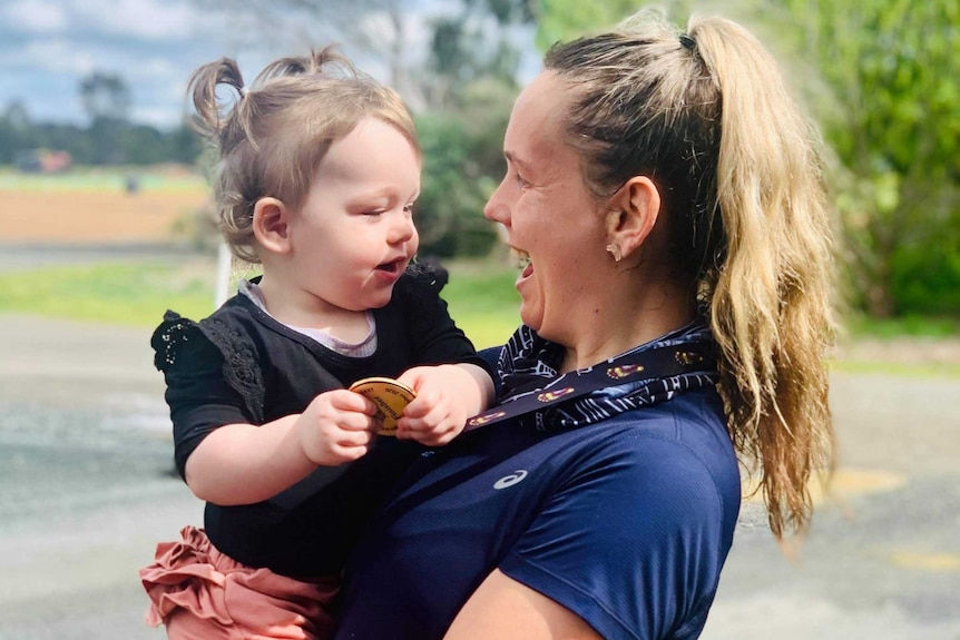 woman holding young child