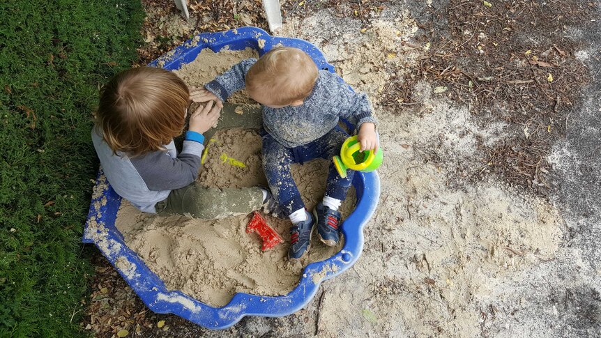 Marion's boys William and Alexander play in the sand