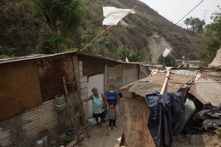 White flags hang from residences in 'Callejon del silencio', an impoverished neighbourhood in Villa Nueva, Guatemala.