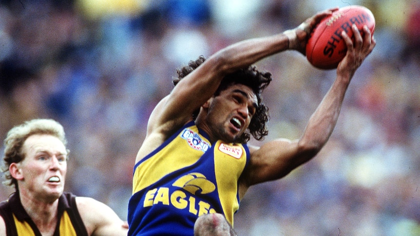 West Coast's Chris Lewis takes a mark over Hawthorn's James Morrissey in the 1991 AFL grand final.