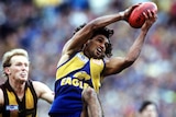 West Coast's Chris Lewis takes a mark over Hawthorn's James Morrissey in the 1991 AFL grand final.