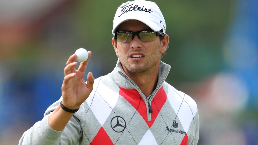 Adam Scott acknowledges the gallery during the first round of the 141st Open Championship.