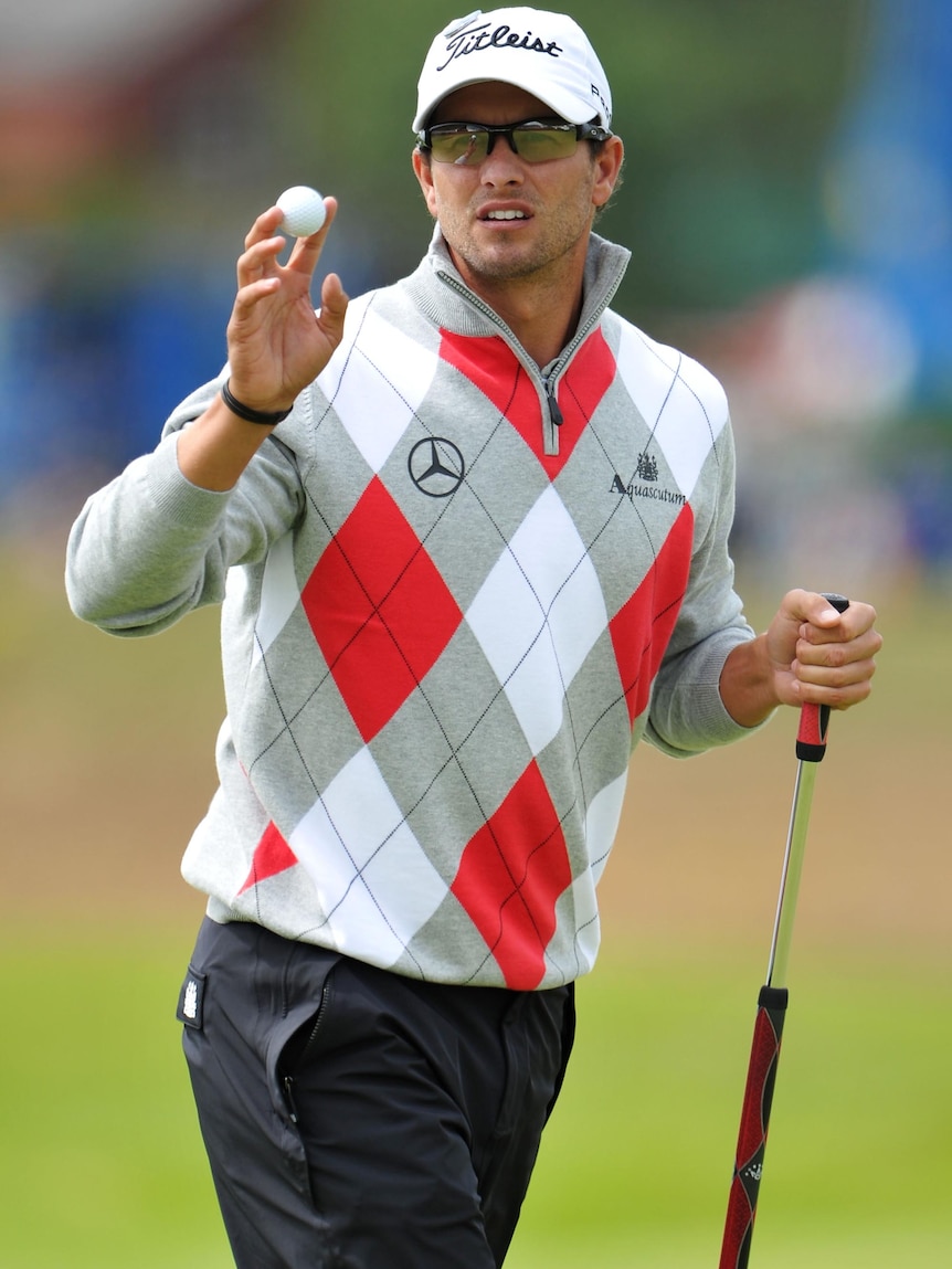 Adam Scott acknowledges the gallery during the first round of the 141st Open Championship.