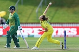 Ellyse Perry is pictured mid bowling action in the Women's Cricket World Cup game against South Africa