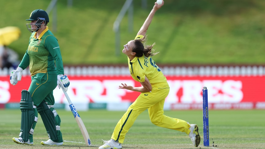 Ellyse Perry is pictured mid bowling action in the Women's Cricket World Cup game against South Africa