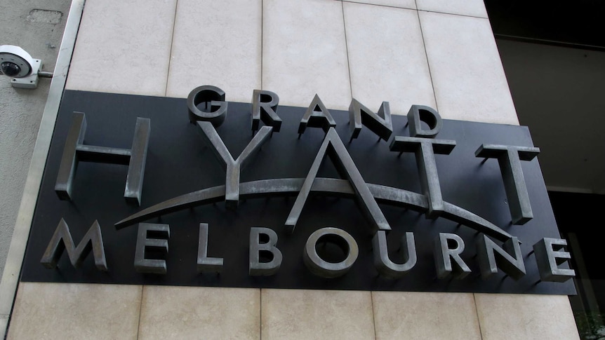 A sign outside a hotel reading 'Grand Hyatt Melbourne'.