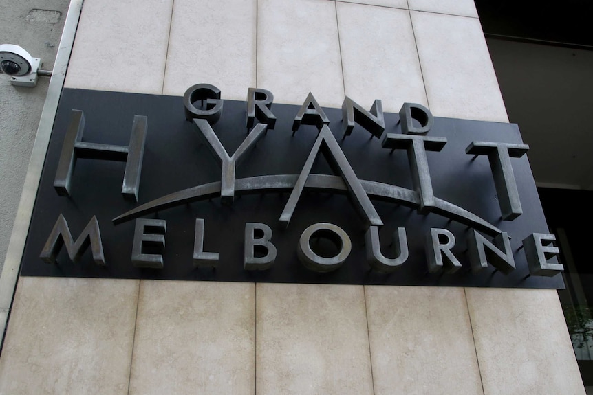 A sign outside a hotel reading 'Grand Hyatt Melbourne'.