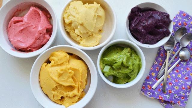 Four types of colourful gelati sit on a plate