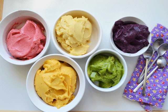 Four types of colourful gelati sit on a plate