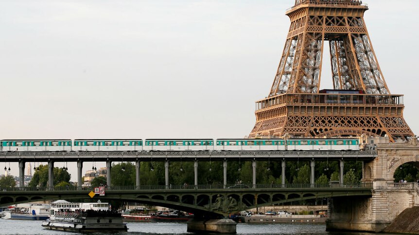 Paris Metro goes past the Eiffel Tower