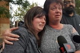 Sister and mother of Alexander Watts cry outside court.