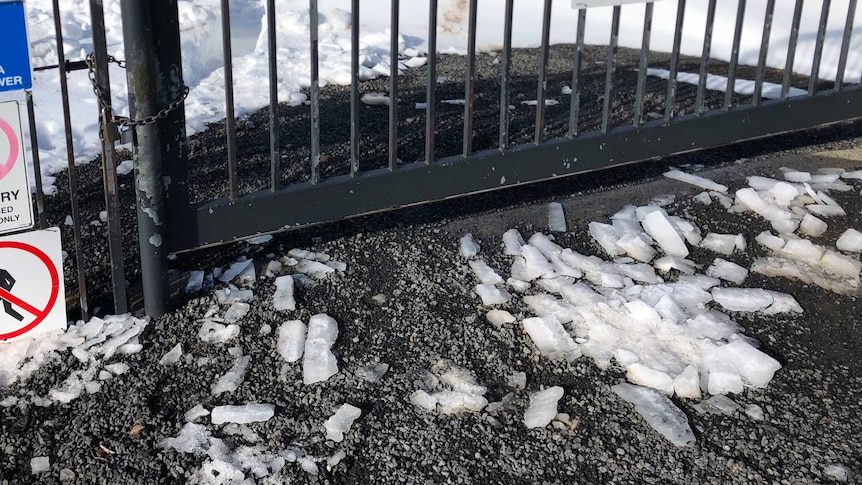 Large pieces of ice on the ground at the Mount Wellington Transmission Tower site.