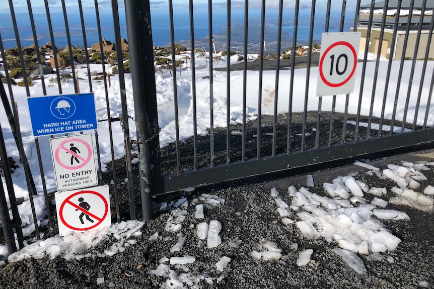 Large pieces of ice on the ground at the Mount Wellington Transmission Tower site.