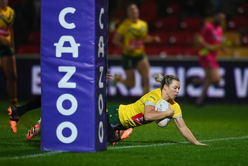 Emma Tonegato goes over for a try for Australia against Papua New Guinea