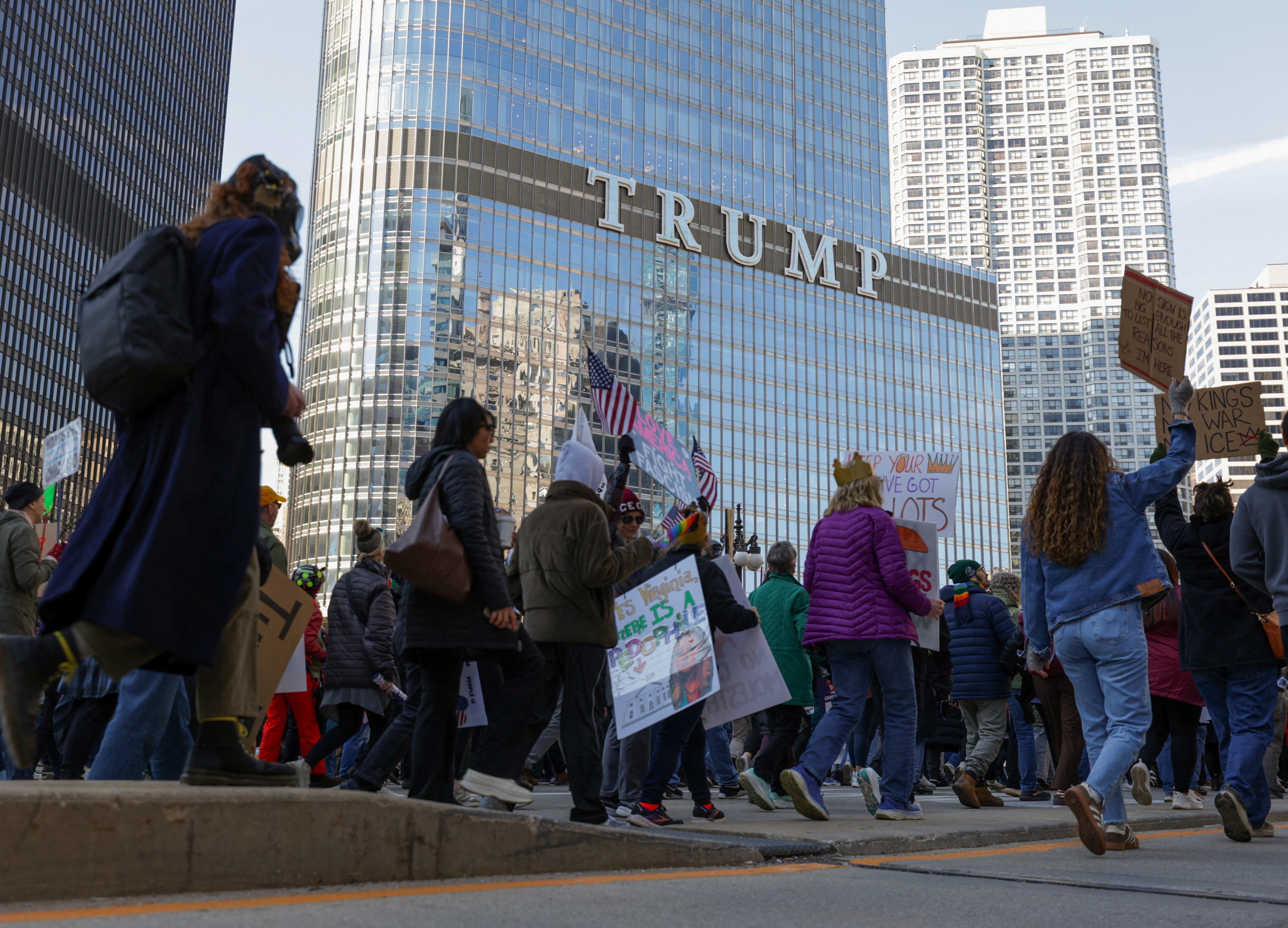 Demonstrators walk past the Trump Tower during a "No Kings" protest.