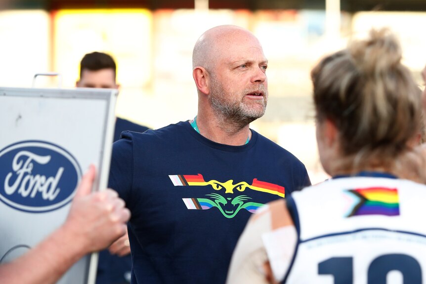 Senior coach Dan Lowther addresses the Geelong AFLW players