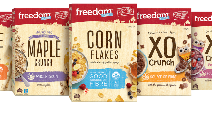 A row of five cereal boxes including Rice Puffs and Maple Cruch, manufactured by Freedom Foods.