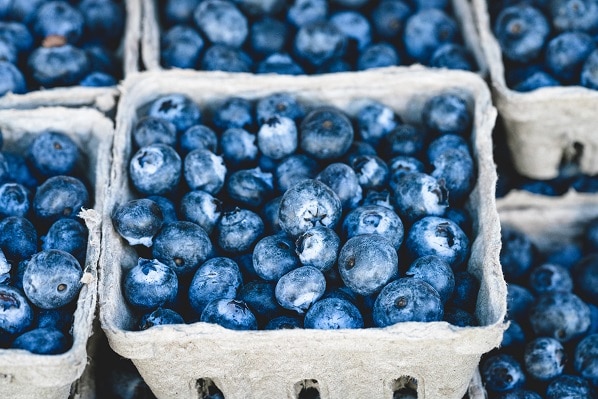 A carton of organic blueberries.
