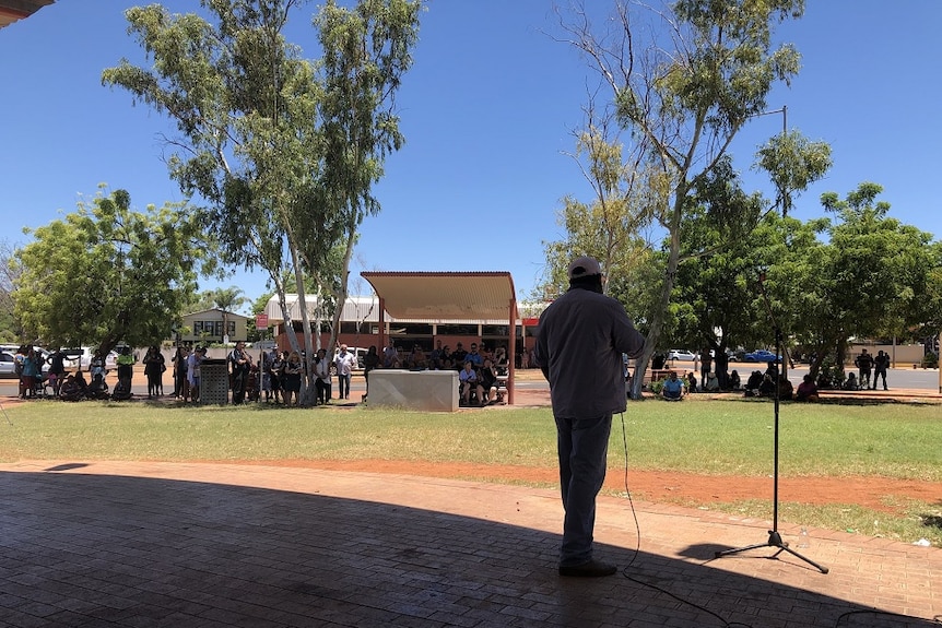 A speaker addresses a crowd during a protest at Tennant Creek.