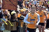 Sam Mitchell is cheered by fans before Hawthorn training