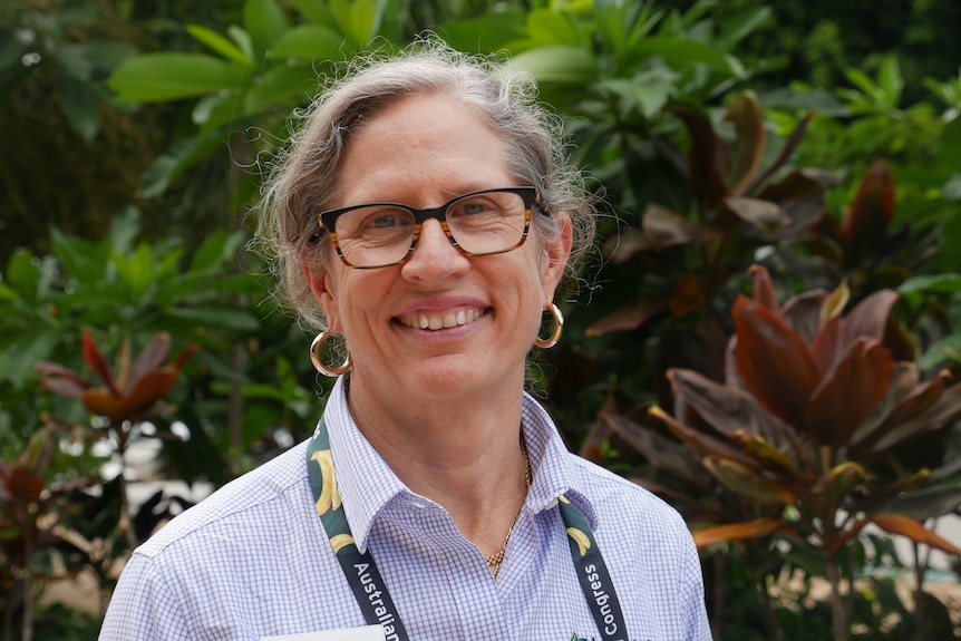 Dr Rosie Godwin smiles at camera wearing glasses