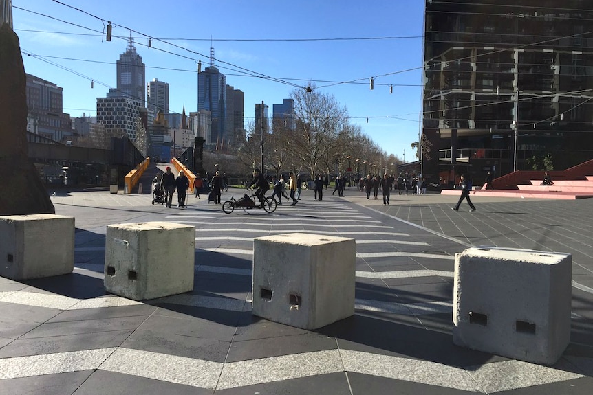 Square concrete bollards along the footpath at Southbank.