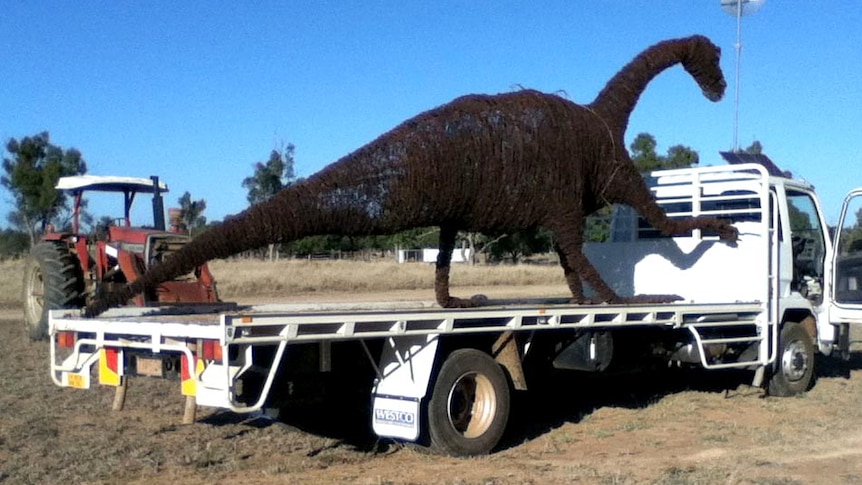 Muttaburrasaurus sculpture on back of truck
