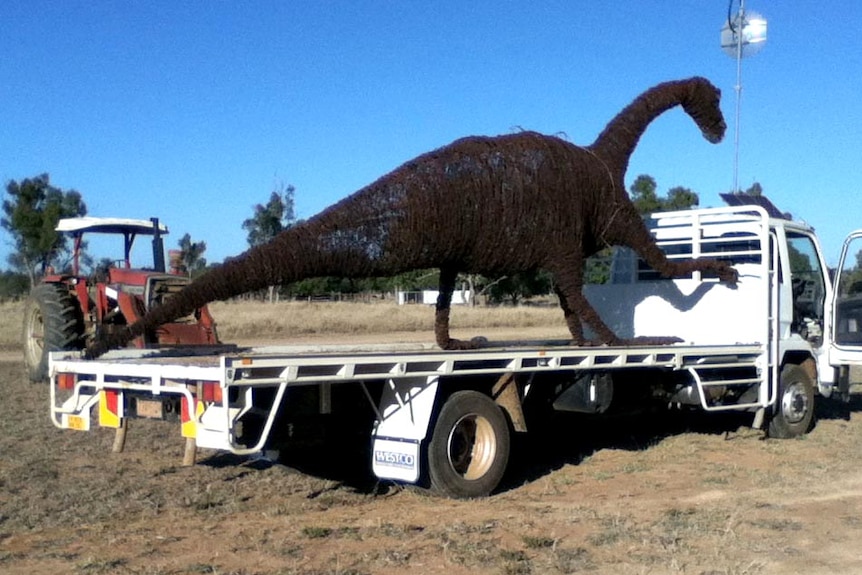 Muttaburrasaurus sculpture on back of truck