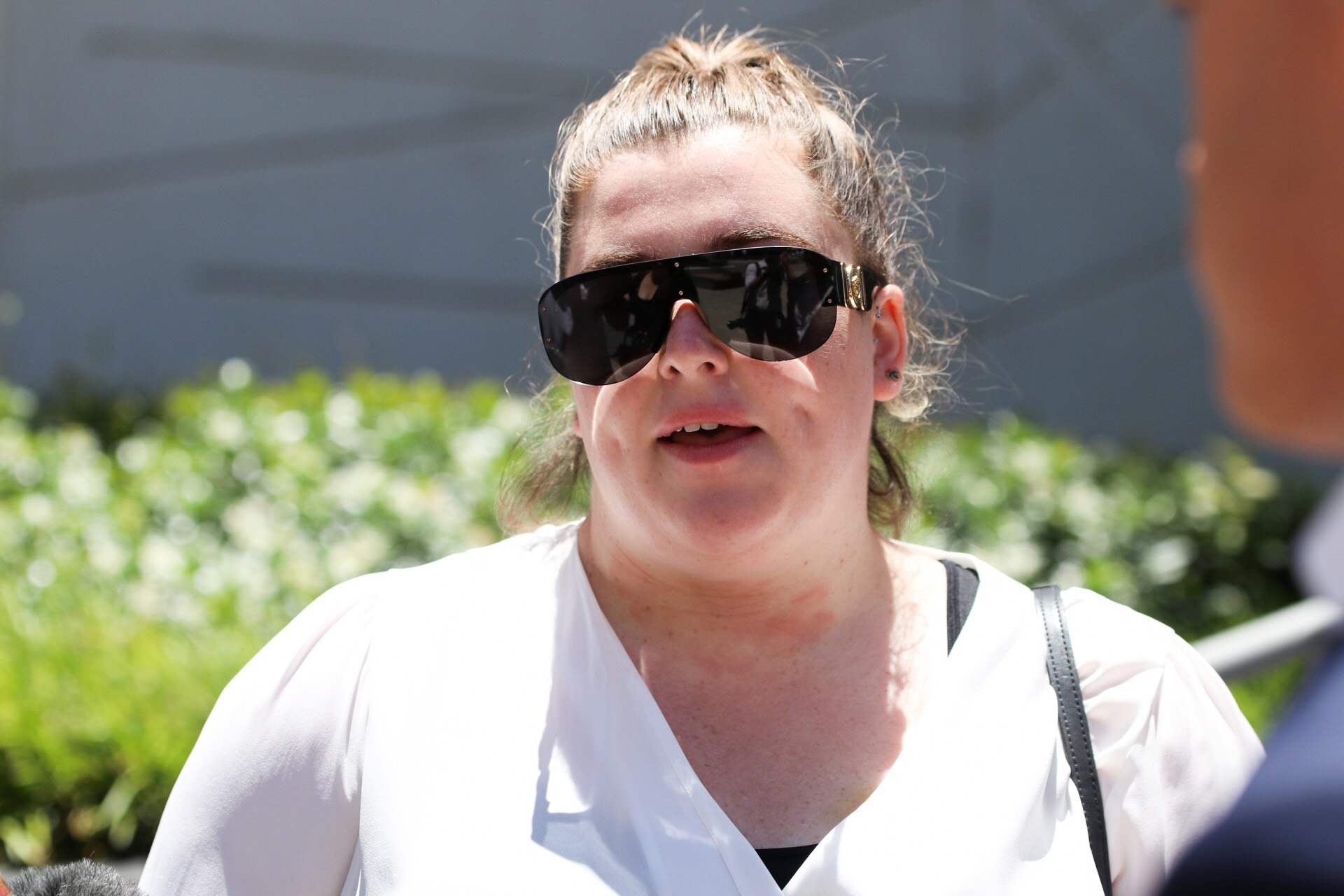 Head shot of a woman in sunglasses
