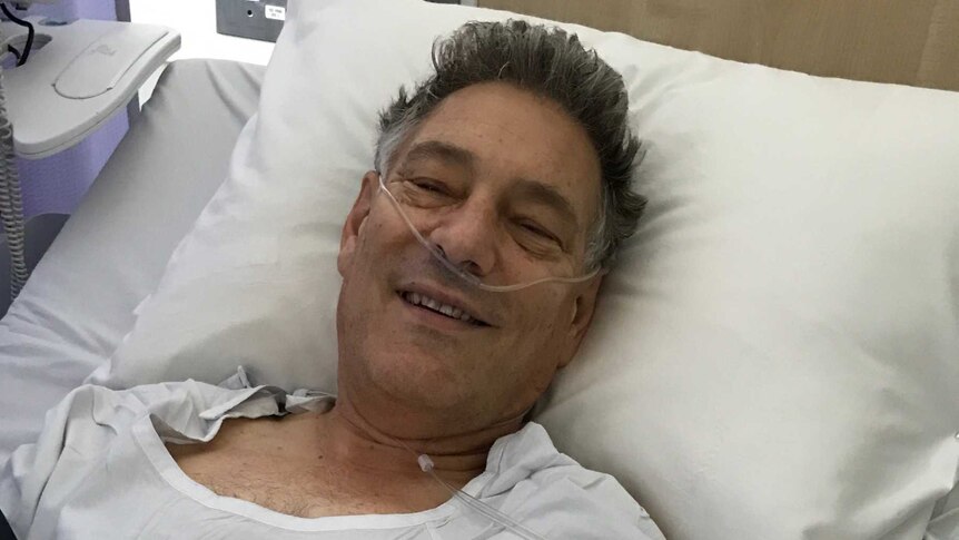 David Santamaria recovering in a hospital bed