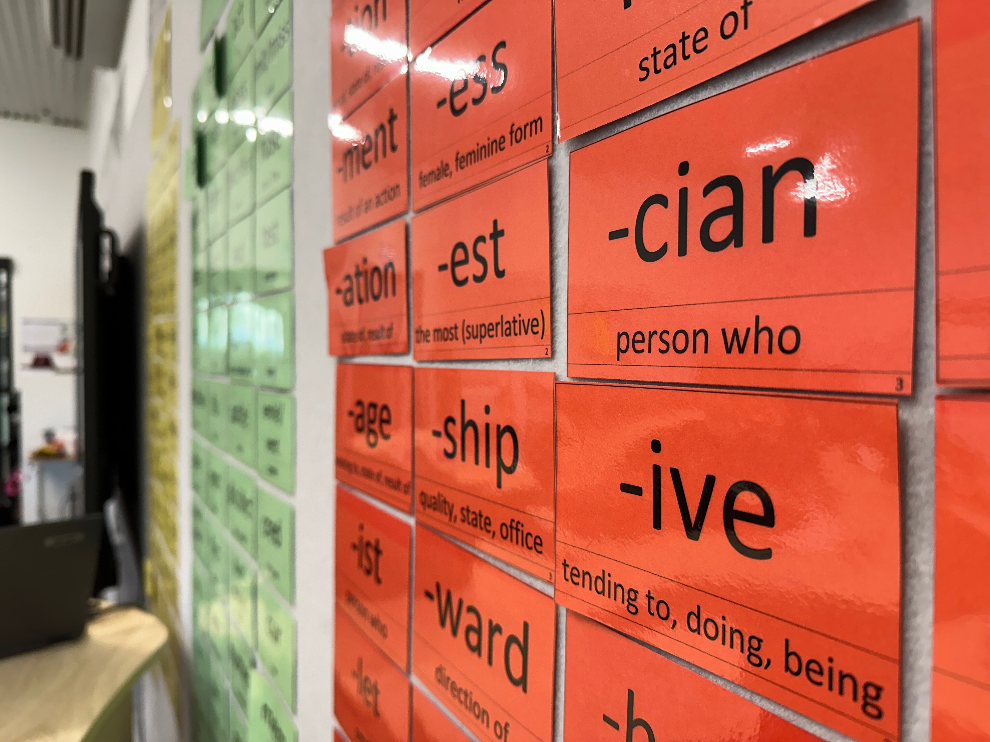 Small laminated bits of paper with phonics on them are seen in a classroom