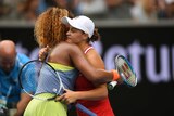 Ashleigh Barty hugs Naomi Osaka after their third-round match at the Australian Open.