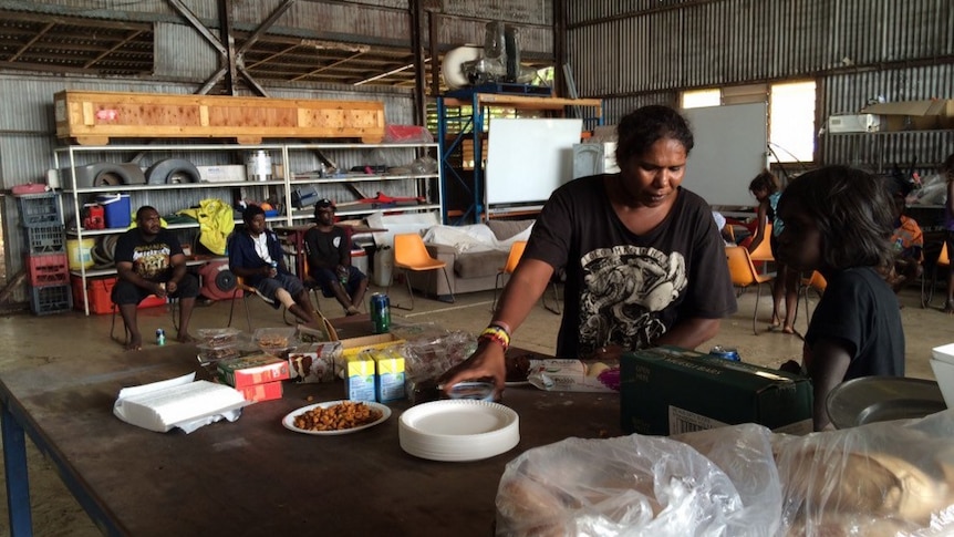 Evacuated Daly River residents have lunch as they wait at Darwin showgrounds