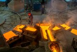 A man works in a copper smelting factory