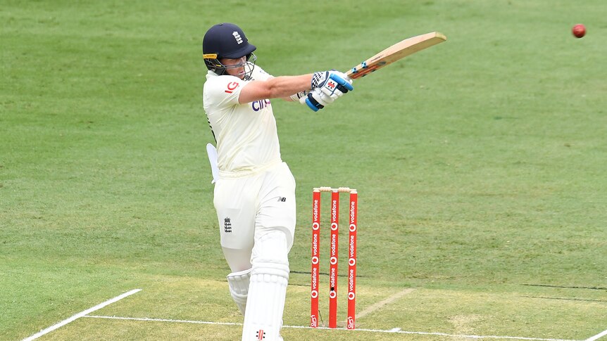 An England batsman pulls the ball away on the on-side during an Ashes Test match.