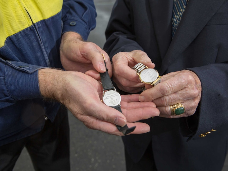 Richard Zabielski (right) and his father Richard Zabielski snr hold their 25-year Ford service watches.