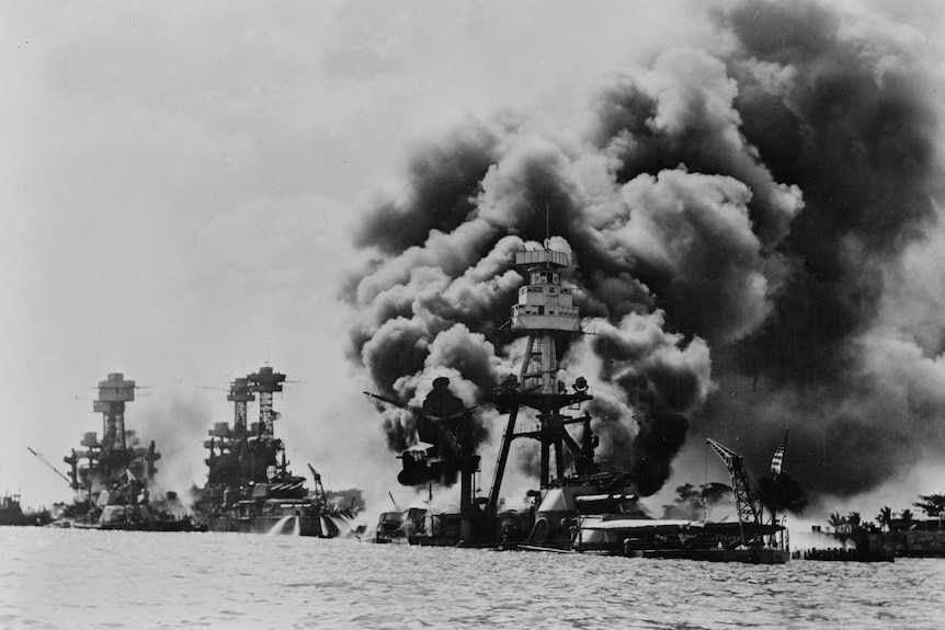 A black and white photo of Pearl Harbor after the attack.