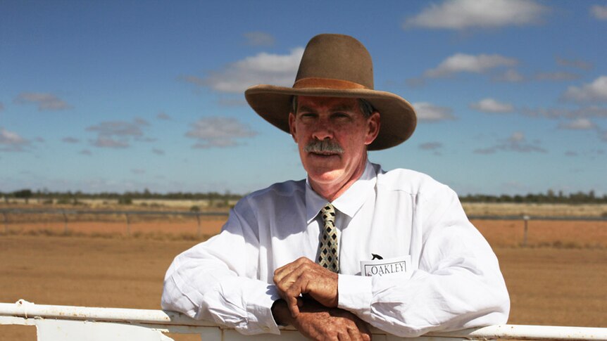 Sam Brown stands in front of the gate at Koorooinya