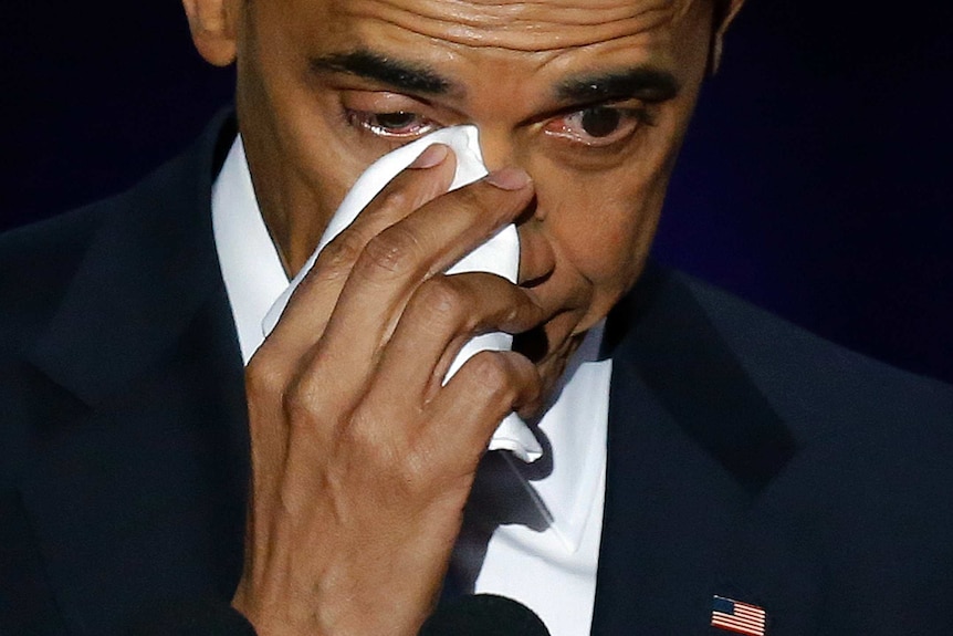 Barack Obama wipes his tears as he makes his farewell speech.