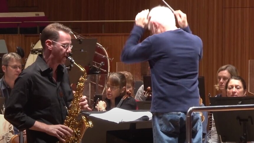 Saxophone soloist Timothy McAllister and composer-conductor John Adams rehearsing with Sydney Symphony Orchestra in 2013.